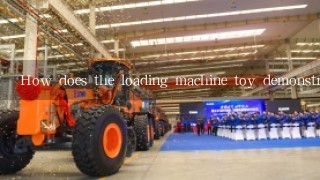How does the loading machine toy demonstrate the concept of energy?